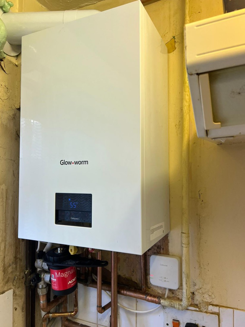 A newly fitted Glow-worm combi boiler with a magnetic filter and heating controls